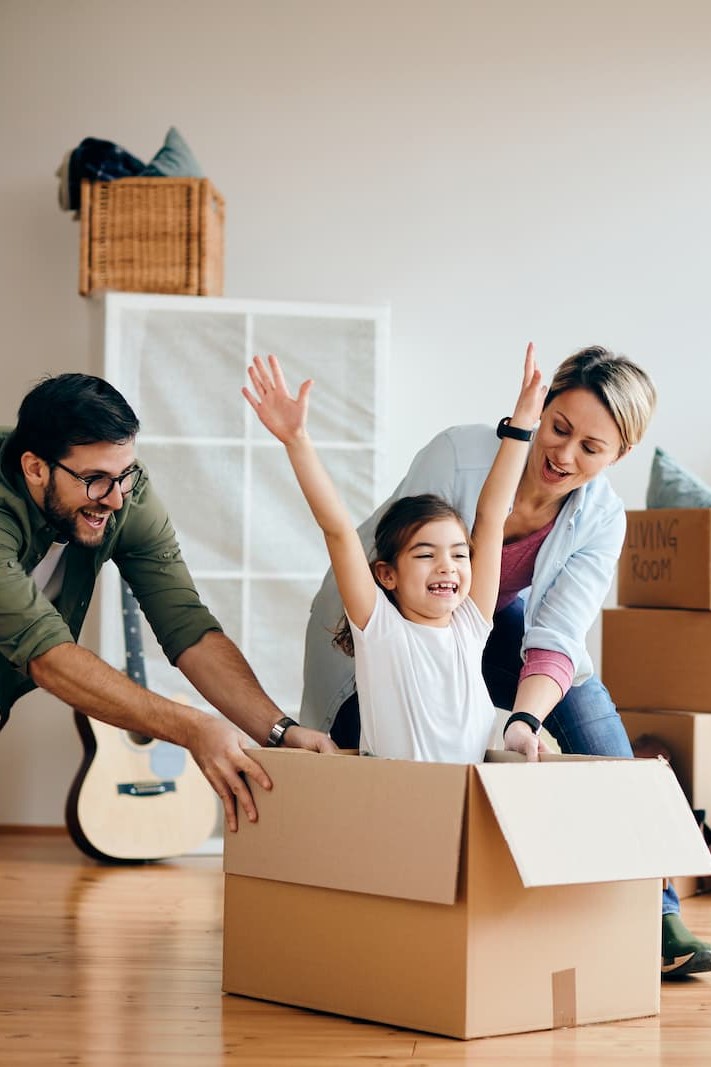 Happy family moving after their home loan from ECCU