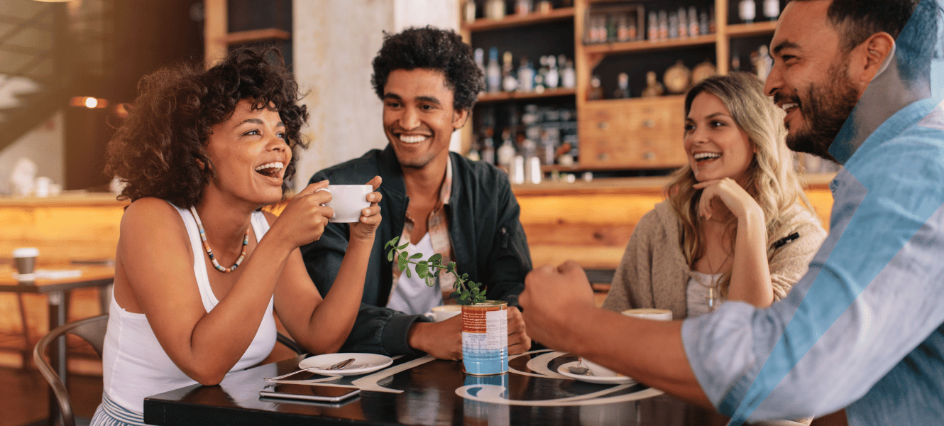 Friends laughing at coffee shop